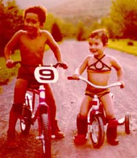 Anton with Erica riding bikes in 1976